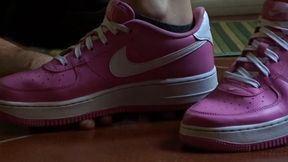 hand trampling in pink sneakers by Alice
