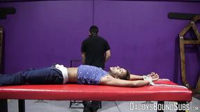 ”Handsome RT cries out in pain from the flogger in his bare flesh”