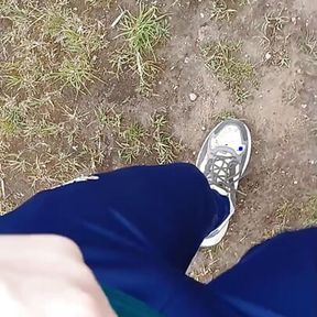 Sexy guy walks in the woods and jerks off his cock in his tight sweatpants