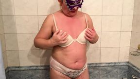Zara takes a bath in the hotel bath in her lingerie