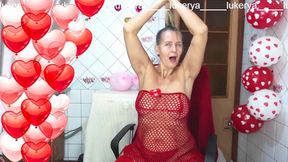 Sexy Lukerya in Red Between Heart-shaped Balloons for Valentine's Day Flirts with Fans in Red High-heeled Shoes on Webcam