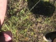 Peeing off tailgate outdoors