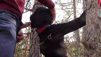 Tied to a tree on a sexy outfit, masked and outdoor deepthroat with no mercy