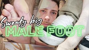 Sweaty big male foot after a long day