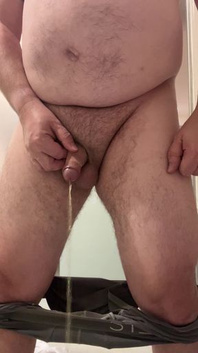 Another Morning piss with my pants pulled down and my foreskin pulled back.