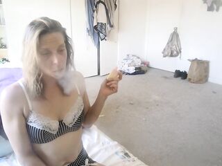 smokin' a cigarette in my baby daddys abode when im not suppost to