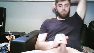 Watch this young, straight dude stroke his toy and finish it off with his facial hair