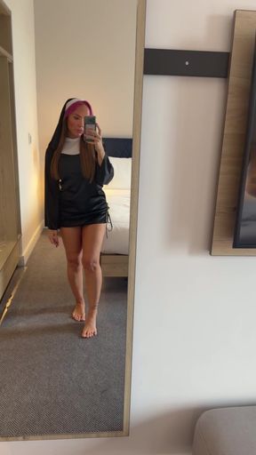 Nun in mirror shows off her pretty solo feet while clothed