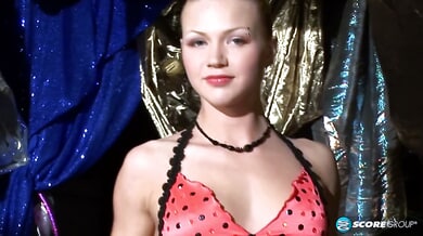 Katerina Kat shows off her flexibility in red polka dots and sheer pantyhose before exposing herself
