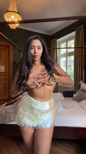 Curvy teen with cute tits strikes a pose in a pro photoshoot