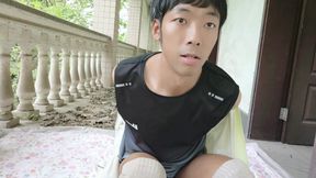 A handsome Asian boy masturbates, moaning, ejaculating, and consuming fluids in an abandoned hotel corridor
