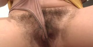 Raven haired bitch with saggy breasts finger bangs her hairy muff for me