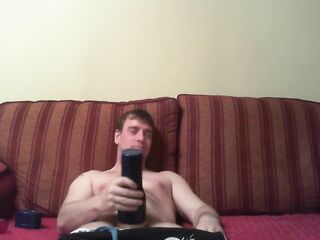 Watching porn playing with a blue fleshlight