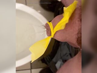 Fastened up micropenis pissing