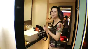 Tattooed cutie w/ curly hair in a hot position