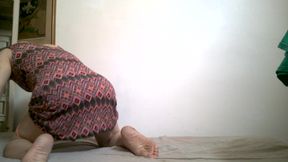 With a woman's dress and orange panties