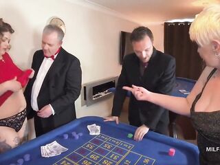 three British MILFs slip without evening dresses at the casino