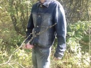 A village guy jerks off a big cock on the river bank, and fishermen swim by on a boat