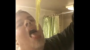 Faggot eats cum filled condom