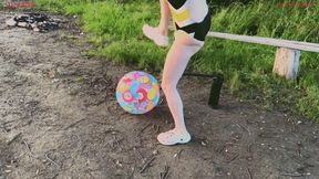 Alla burst a beach ball with her foot