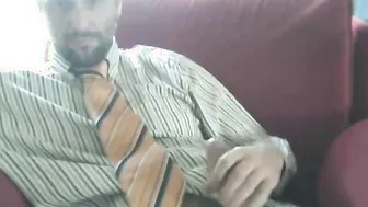 Suited daddy bear jerks off in solo masturbation