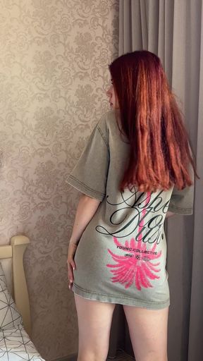 Sexy red hair girl in a t-shirt