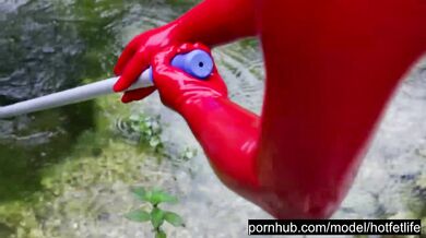 Hot Blonde Girl Works And Piss Outdoor In The Garden In Red Latex Catsuit + Gloves + High Heels