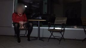 Crossdresser masturbating in front of hotel at night