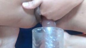 I put a dildo in a glass and ride it with my shaved cunt