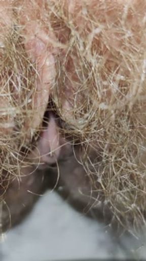 Little cute piss through huge bushes of hairy pussy