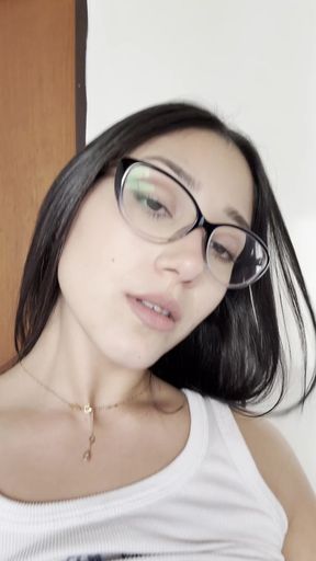 Woman in glasses looking to the side