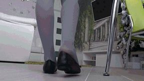 long day at work in tight black flats back view d