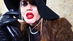 Femme fatale wearing fur coat and leather gloves