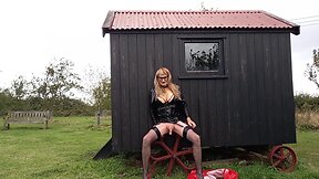 Pvc-clad trans person cumming outdoors in the rain