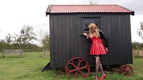 Pvc-clad trans person cumming outdoors in the rain