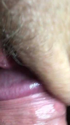 Close-up POV rubbing the clitoris with the big mushroom head of a hard cock. Huge cum load on her clit, bushes and panties.