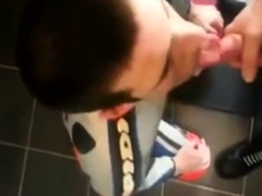 Biker gives blowjon to skin in toilets