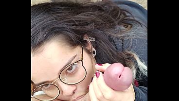 Cute nerd girlfriend gives sloppy POV blowjob in public park