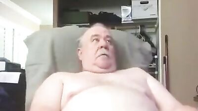 Fat grandpa is playing with his small cock and balls