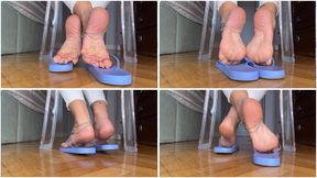 Solesmad dangling in lilac flip flops white pedi, back view from the ground