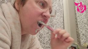 Tooth brushing and tongue scrubbing from profile view