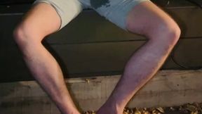 amateur boy pee on himself in the garden (wets his grey shorts, grey undies and white tshirt)