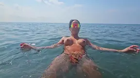 Brazen And Sex-Obsessed Stepmother Strips Naked And Shows Stepson Her Big Tits On A Public Beach