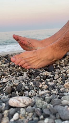 Feet play on the beach