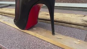 Louboutin crush, high heels bending, one heel standing, high heels crush, sinking heels into wooden planks