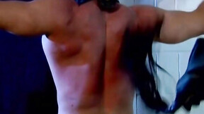 Muscled Derek Pain takes flogging all over his hot back til it is rosy red