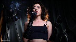 Great smoker Anastasia is smoking two all white cigarettes in a leather gloves