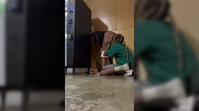 Insane public quickie by a black couple hiding behind a vending machine