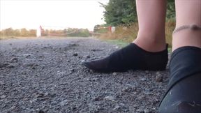 Bright Pantyhose and Beach Shoes in Puddle