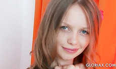 Gloria strips sensually and flashes her tiny boobs